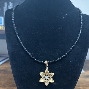1928 Black Beaded Necklace with Gold Flower Pendant